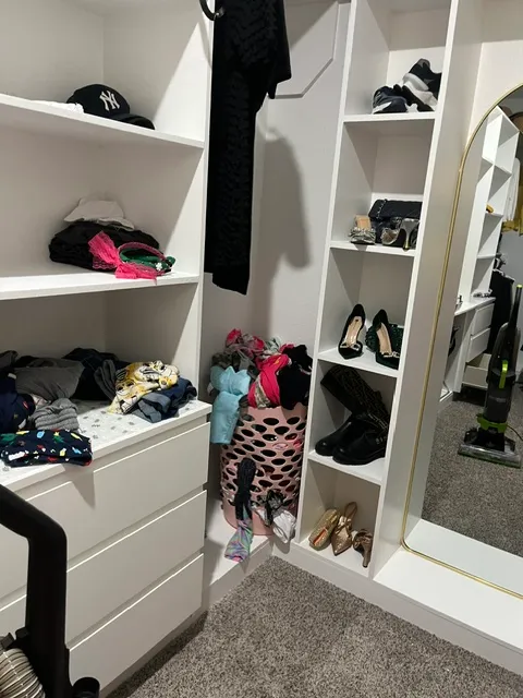 Before cleaning: Disorganized closet with cluttered shelves