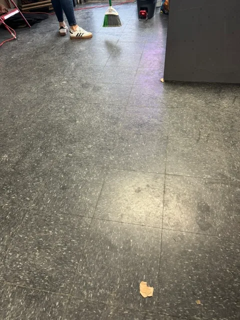 Before cleaning: Dirty floor with footprints
