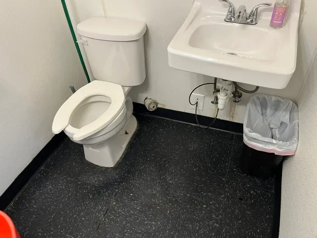 After cleaning: Clean spotless bathroom sink and toilet