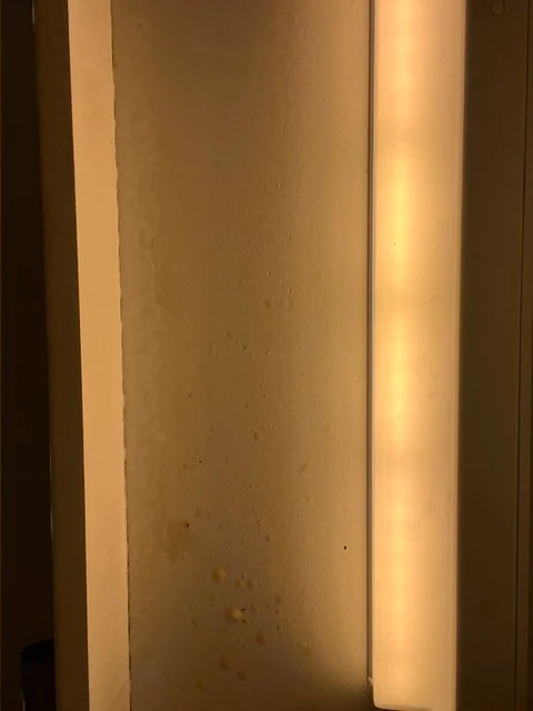 Before cleaning: Dirty wall with visible stains